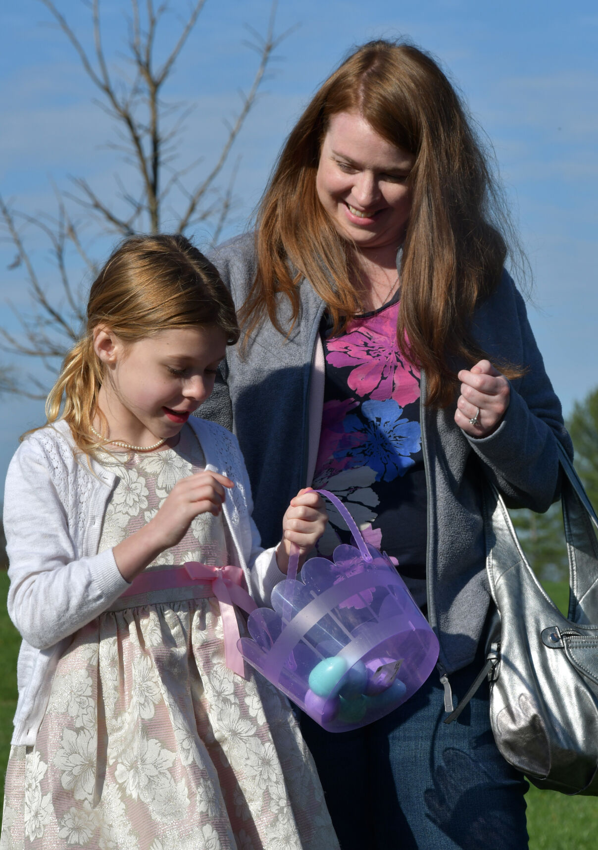 Lacey Lurtz shows Syria Lurtz her Easter egg haul